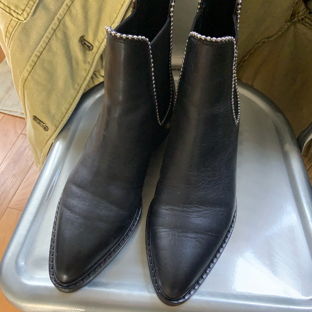 Black leather studded Chelsea boots by Coach. Size 8.